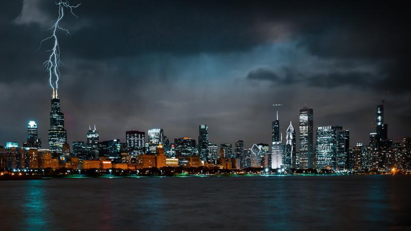 Lightning strikes a high rise building in Chicago at night