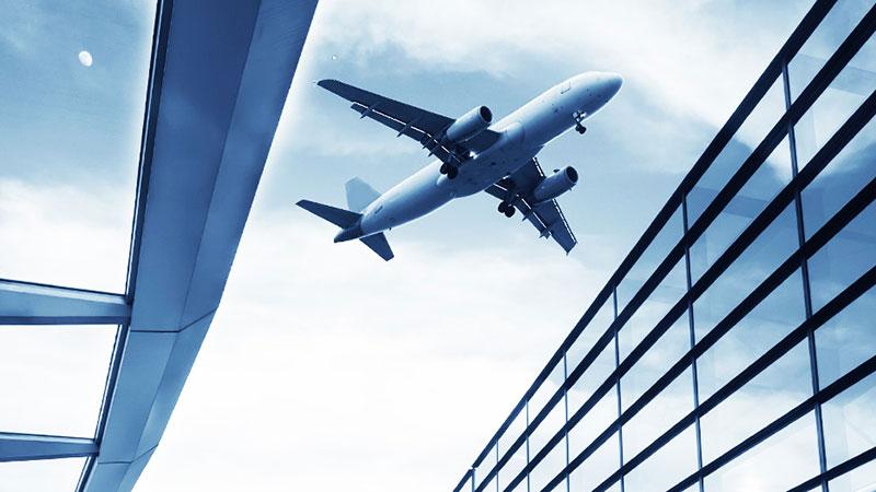 Airplane over buildings