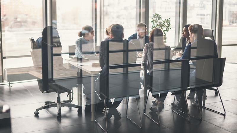Meeting room in an office. Meeting ongoing.
