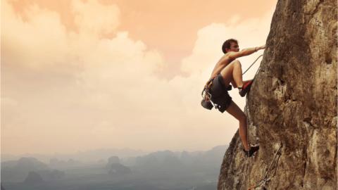 A man climbing a mountain