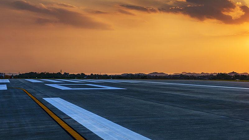 Airport runway in sunset