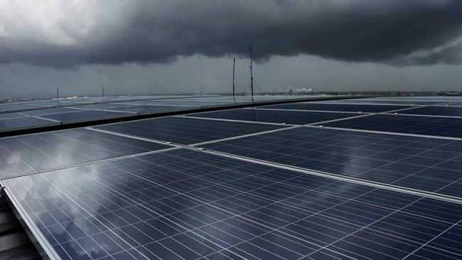 Solar PV rooftop under storm cloud