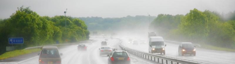 Cars on a highway in heavy rain